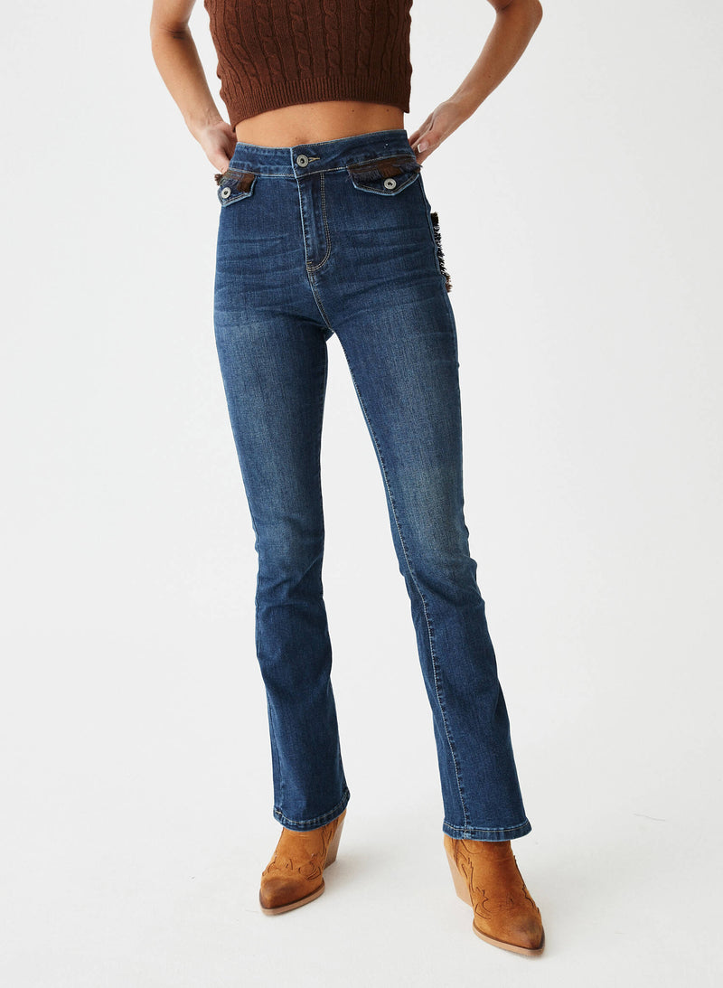Pantalón denim bolsillos tapicería