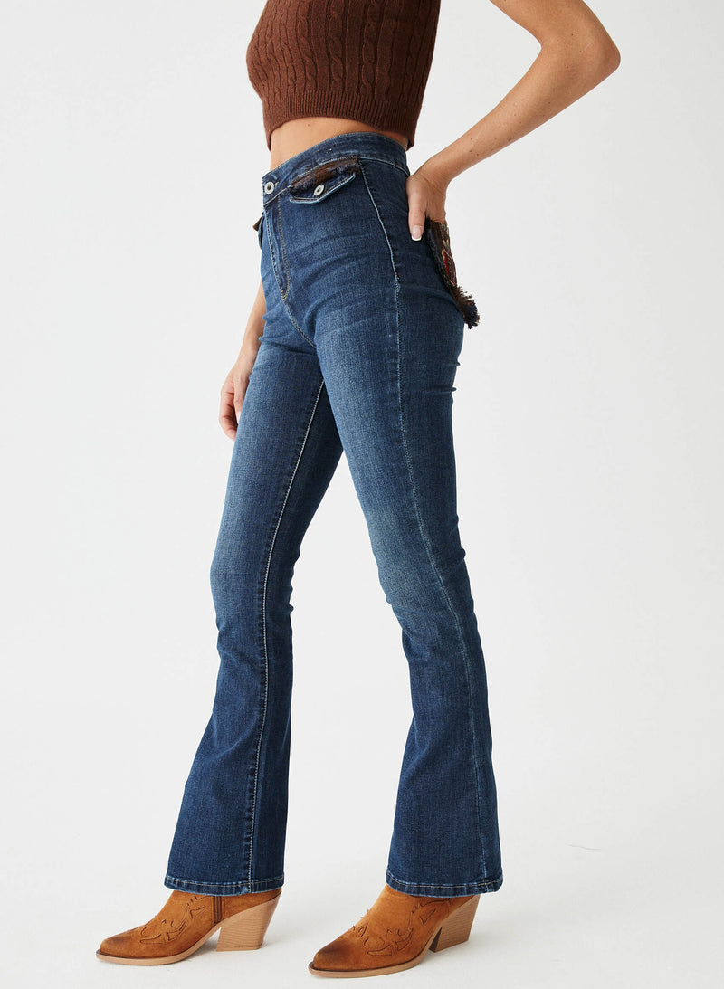 Pantalón denim bolsillos tapicería