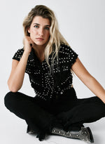 Chaleco denim tachas